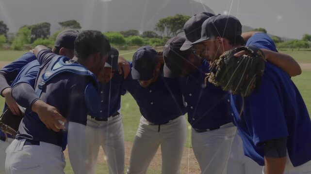 Eight baseball players forming huddle for unity before game with digital overlay intensifying
