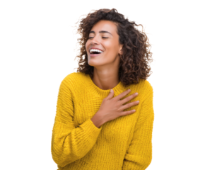 Happy woman with curly hair laughs, wearing a yellow sweater.