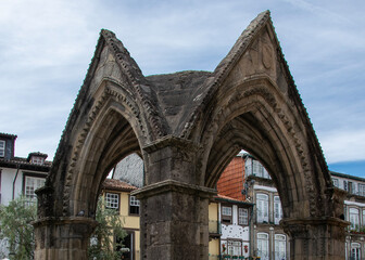 Stone arches in historic square, guimaraes city, portugal