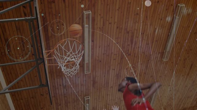 Teen boy dribbling into gym bending knees, launching dunk for PE class with digital flares swirling