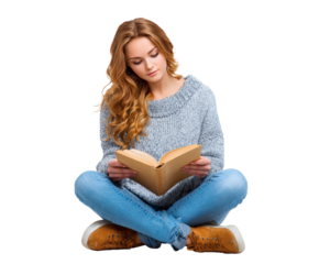 Young woman reading a book while sitting cross-legged