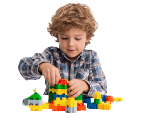 Young boy playing with colorful building blocks