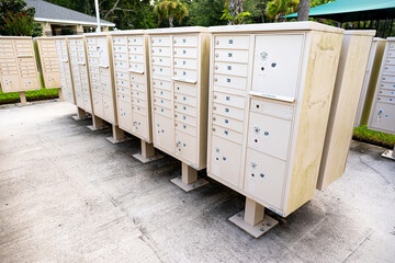 Group of outdoor community mailboxes in residential neighborhood for postal delivery, housing services, and shared mail distribution.