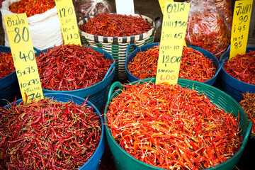 Colorful array of spicy red and green chilies at an Asian market in Thailand