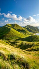 Lush green hills meet a bright blue sky