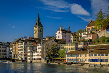 Iconic St. Peter s Church, historic buildings on the Limmat, Zurich, Switzerland