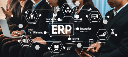 A diverse group of professionals engaged in digital collaboration, showcasing concepts of business planning and enterprise resource management in a modern office environment. Amity