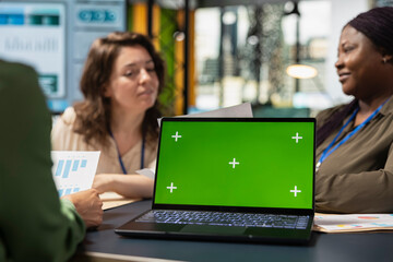 Diverse businesswomen using copy space mockup for performance indicators, setting company...