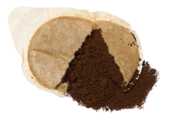 Torn round coffee pod or single serving of ground coffee wrapped in filter paper. Isolated background