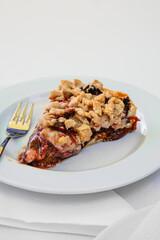 Slice of Cherry Streuselkuchen on White Plate