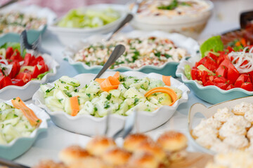 Delicious array of fresh salads served at a festive outdoor gathering during summer