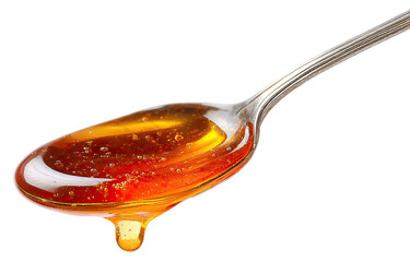 Honey drips from a spoon.  Rich amber liquid with bubbles.  Metallic spoon