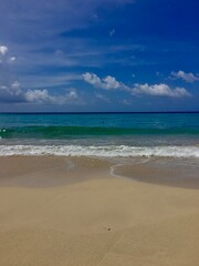 Tropical Beach with Clear Blue Sky and Ocean Waves