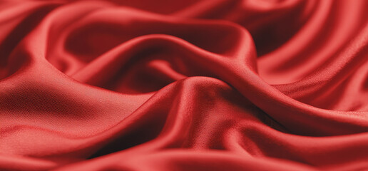 Obraz premium Close-up of rich red satin fabric with flowing folds