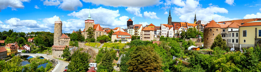 The Panorama captures the charm of an old German town Bautzen with colorful houses, imposing church towers, city fortifications, and a harmonious blend of nature and architecture.