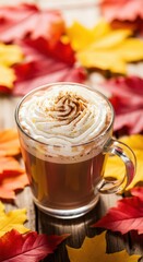 Cozy autumn vibes with a pumpkin spice latte, topped with whipped cream and cinnamon, surrounded by colorful fall leaves on a rustic wooden surface .