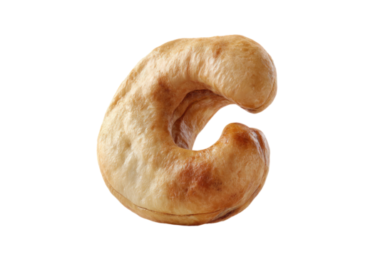 Close-up of a single, whole cashew.  Its light brown skin is visible, with a slightly uneven texture.  The cashew is shaped like the letter "C