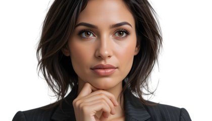 Confident business woman in suit with hand on chin isolated on white isolated on transparent background