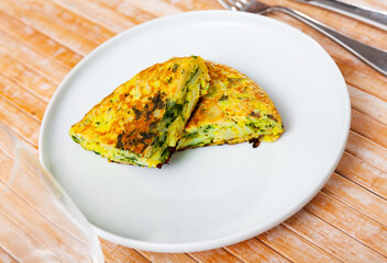 Omelet cooked with spinach served on plate for breakfast