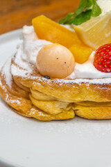 Delicious dessert stack with fresh fruit toppings, perfect for cafes, restaurants, and food blogs