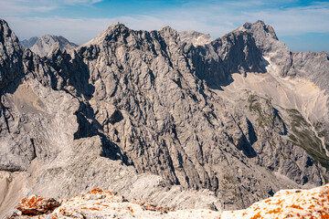 Scenic View Of Zugspitze And Jubilee Ridge From Via Ferrata Alpspitze: Rugged Rocky Peaks Of The Bavarian Alps Under Clear Blue Sky