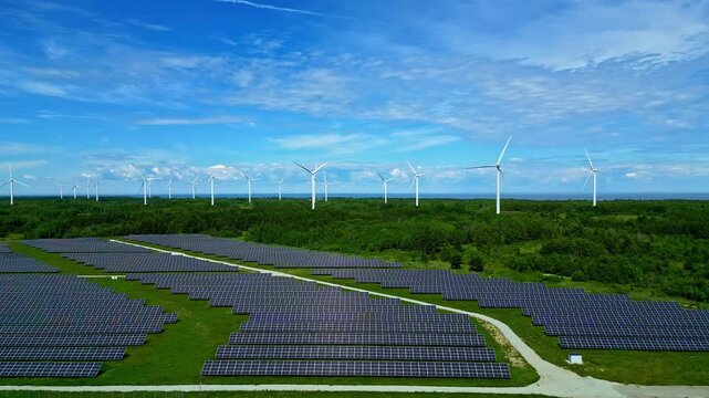 Aerial Drone View of Solar Panel Array and Wind Farm &ndash; Green Renewable Energy Park
Aerial shot of a utility‑scale solar panel array alongside wind turbines generating clean electricity. Ideal for sust