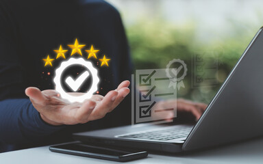 Businessman hand showing five-star rating and quality assurance icon, symbolizing customer satisfaction, product guarantee, ISO certification and service excellence in business standards.
