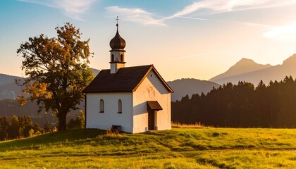 Picturesque chapel at sunset in a mountain valley