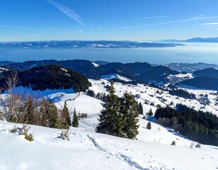 Snowy mountain range overlooking a lake