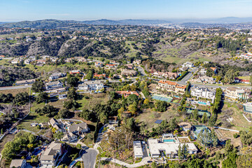 Diamond Bar, Los Angeles County, CA, California, January 26, 2024: Aerial Drone View toward Country Park, Indian Creek Rd, Loma Linda with Mountain Village, Homes, Houses, Streets
