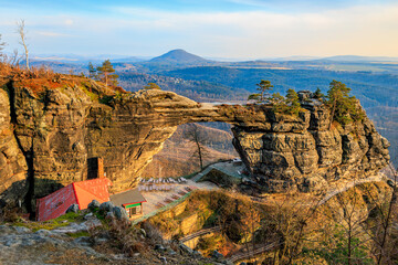 Fototapeta premium Majestic sandstone arch in bohemian switzerland national park at sunrise