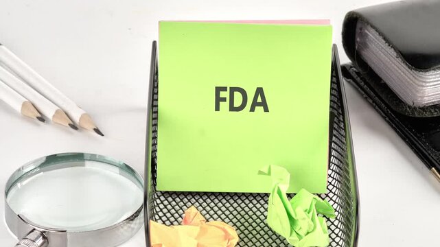 Animation of the FDA text on a green sticker on the table. Food and Drug Administration ( FDA ) Department Service Medical Concept