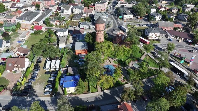 Aerial Strzelno Poland water tower historic pull tilt. Central north Poland. German occupation World War II. Farm rural area. Historical trade and religious center. Historic buildings rural village.