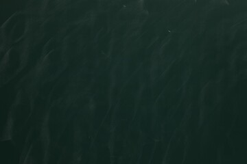 Chalk rubbed out on green chalkboard as background, closeup. Space for text