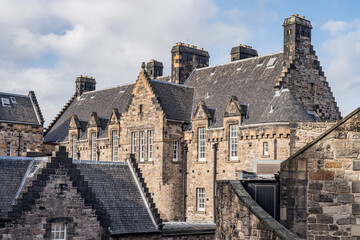 Naklejka premium Sunny landscape of the beautiful Dean’s Village in the city of Edinburgh, Scotland. Beautiful quaint homes in the Dean Village in Edinburgh.