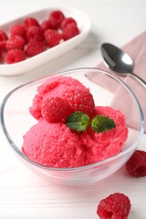 Delicious raspberry sorbet with mint in bowl and fresh berries on white wooden table, closeup