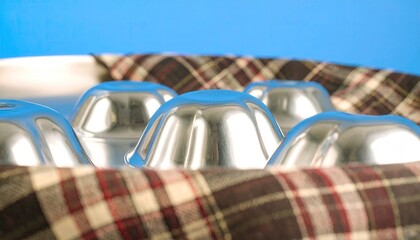 Reflective Chrome Jelly Blobs on Plaid Fabric