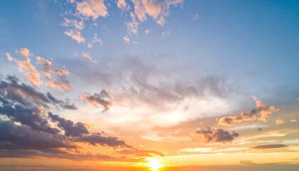 Fototapeta premium A breathtaking sunset view with a vibrant array of colors across a dramatic sky filled with varied clouds.