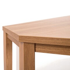 Close-up corner of light brown wooden table