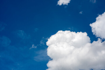 Clear Blue Sky with White Fluffy Clouds