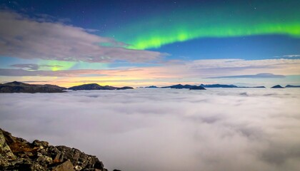 Mesmerizing Aurora Borealis Over Foggy Mountain Landscape at Dusk