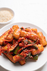 Korean kimchi cucumber on white plate, Korean side dish, Homemade food