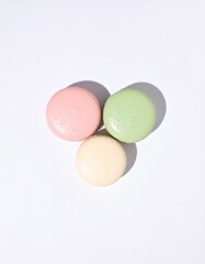 Delicate pastel macarons arranged artfully, inviting sweet indulgence and gourmet delight