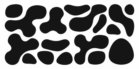 Abstract black organic shapes scattered on a white background creating a playful pattern