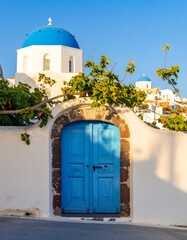 Blue door, whitewashed walls, blue domes