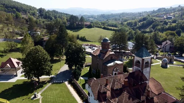 Aerial view of Church of Saint Basil of Ostrog near Valjevo, Serbia, surrounded by rural landscape. g.