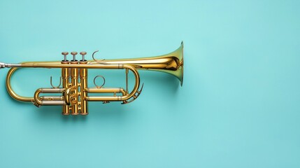 Fototapeta premium One trumpet on light blue background, closeup. Space for text