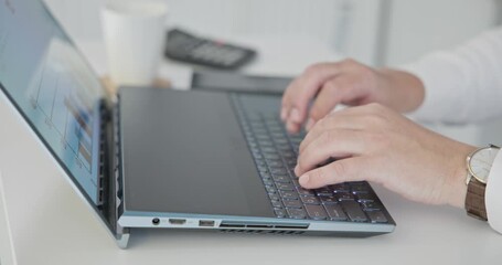 man in shirt typing on laptop keyboard in office - close up of hands - Powered by Adobe