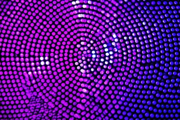 Abstract swirling pattern of purple and blue dots