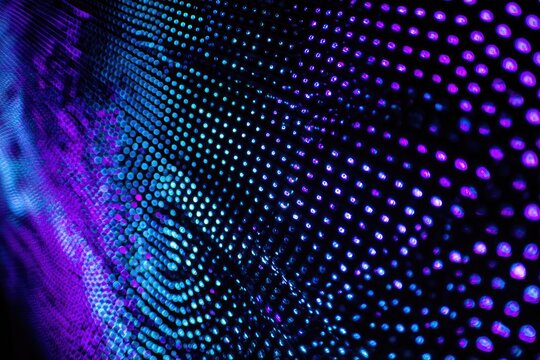 Abstract close-up of a vibrant LED display, showcasing a gradient of purple and blue dots - Powered by Adobe